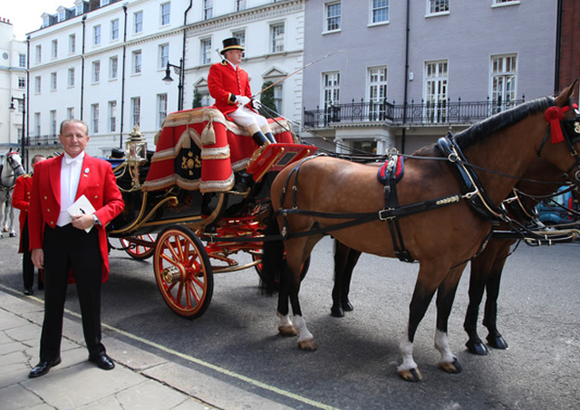 With Royal Carriage